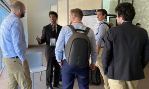 Ajay at poster with group