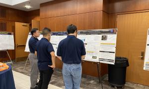 Poster Session:  Group shots of JANUS members viewing posters