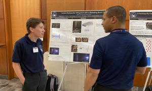 Poster Session:  Group shots of JANUS members viewing posters
