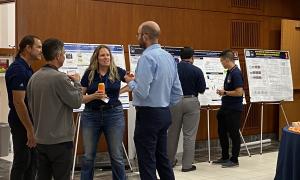 Poster Session:  Group shots of JANUS members viewing posters