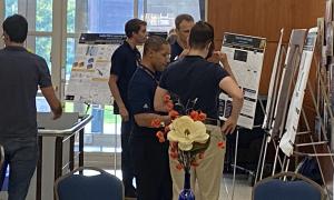 Poster Session:  Group shots of JANUS members viewing posters